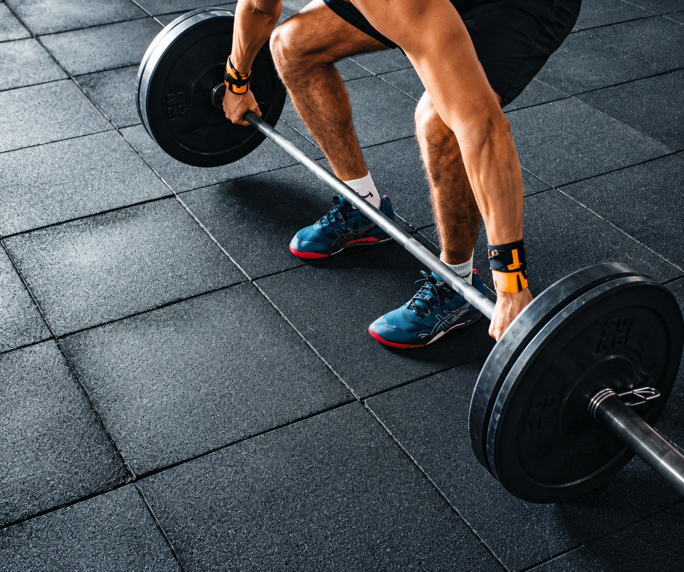 Athlete lifting a kettlebell in a strength gym