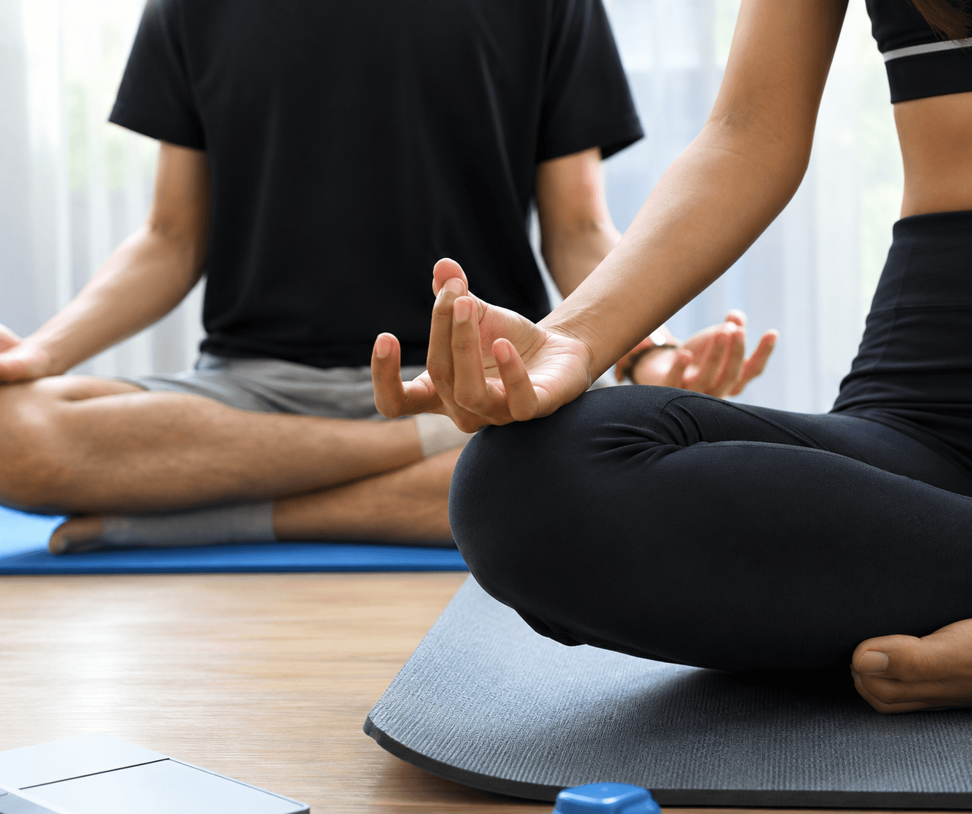 Person holding a yoga pose in a sunlit room
